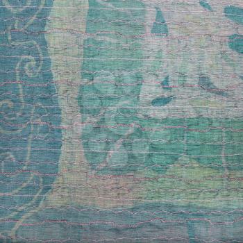 textile square background - transparent stitched clenched green silk fabric and painted batik on background