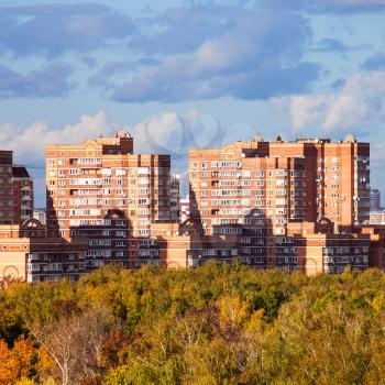 apartment houses in living urban quarter in sunny autumn day