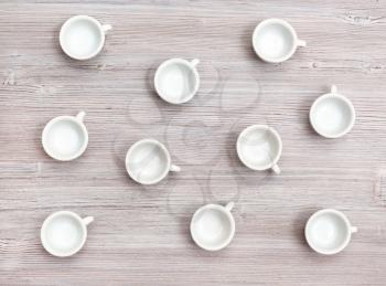food concept - top view of many white cups on gray brown table