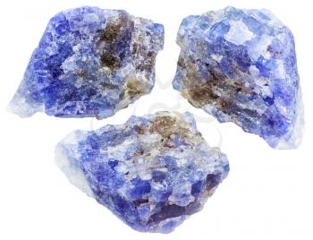 set of raw tanzanite (blue violet zoisite) crystals and rocks isolated on white background