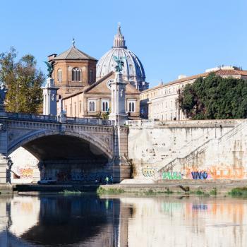 travel to Italy - view of dome of St. Peter's Basilica and bridge Ponte Vittorio Emanuele II from Tiber river in Rome