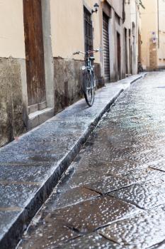 travel to Italy - wet street in Florence city in autumn rain