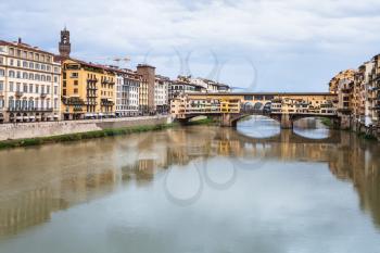 travel to Italy - view of Ponte Vecchio (Old Bridge) over Arno river Florence city in autumn rainy day