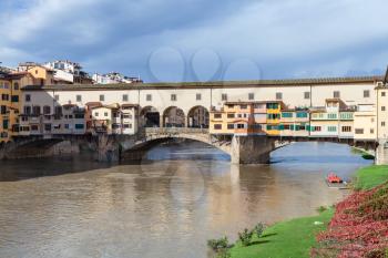 travel to Italy - view of Ponte Vecchio (Old Bridge) over Arno river in Florence city in sunny autumn day