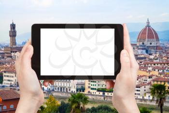 travel concept - tourist photographs Florence evening skyline on tablet with cut out screen with blank place for advertising in Italy