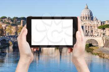 travel concept - tourist photographs Rome cityscape on tablet with cut out screen with blank place for advertising in Italy
