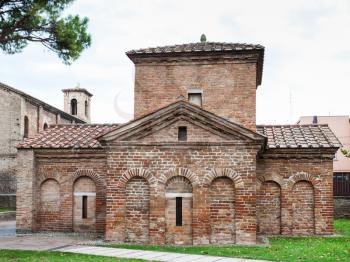 RAVENNA, ITALY - NOVEMBER 4, 2012: Ancient Galla Placidia mausoleum in Ravenna city. It was built between 425 and 433, this small mausoleum adopts a cruciform plan.