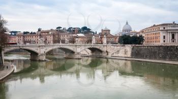 Travel to Italy - view on Tiber river with bridge in Rome city in winter