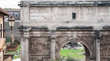 Travel to Italy - marble Arch of Septimius Severus in Roman Forum in Rome city in winter