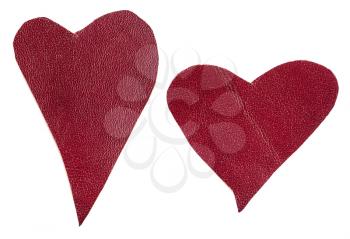 pair of red leather hearts isolated on white background