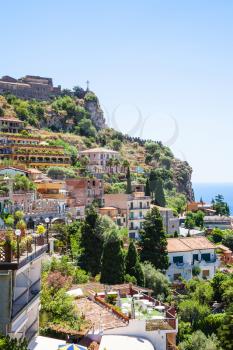 travel to Italy - view of houses in Taormina city from Castelmola village in Sicily in summer day