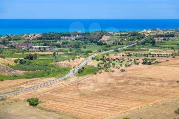 travel to Italy - agrarian fields and village near Agrigento town on coast of Mediterranean sea in Sicily