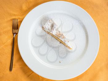 travel to Italy, italian cuisine - top view of traditional sicilian sweet lemon cake on white plate in Sicily
