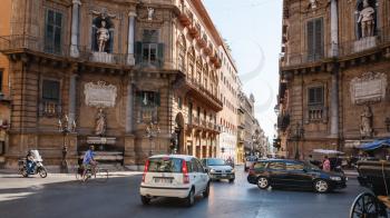 PALERMO, ITALY - JUNE 24, 2011: people and cars on square Quattro Canti (Piazza Vigliena). The square was laid out at the crossing of the two principal streets Via Maqueda and Corso Vittorio Emanuele