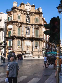 PALERMO, ITALY - JUNE 24, 2011: people on central square Quattro Canti (Piazza Vigliena). The square was laid out at the crossing of the two principal streets Via Maqueda and Corso Vittorio Emanuele