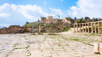 Travel to Middle East country Kingdom of Jordan - view of Oval Forum and Zeus Temple in Jerash (ancient Gerasa) town in winter