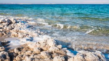 Travel to Middle East country Kingdom of Jordan - shore of Dead Sea in sunny winter day