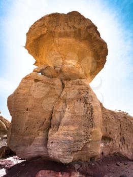 Travel to Middle East country Kingdom of Jordan - Mushroom rock in Wadi Rum desert in sunny winter day