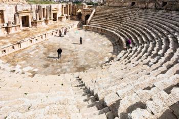 JERASH, JORDAN - FEBRUARY 18, 2012: people in Large South Theatre in winter. Greco-Roman town Gerasa (Antioch on the Golden River) was founded by Alexander the Great or his general Perdiccas