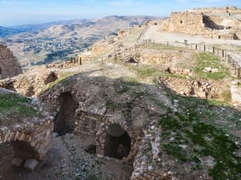 AL-KARAK, JORDAN - FEBRUARY 20, 2012: ruined rooms on upper court of medieval Kerak castle. Kerak Castle is one of the largest crusader castles in the Levant, it constructione began in the 1140s