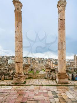 JERASH, JORDAN - FEBRUARY 18, 2012: columns of Temple of Artemis in winter. Greco-Roman city Gerasa (Antioch on the Golden River) was founded by Alexander the Great or his general Perdiccas