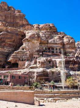 PETRA, JORDAN - FEBRUARY 21, 2012: museum in caves of ancient Petra town. Rock-cut town Petra was established about 312 BC as the capital city of the Arab Nabataean