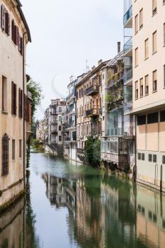 travel to Italy - apartment houses on waterfront canale piovego in Padua city in spring