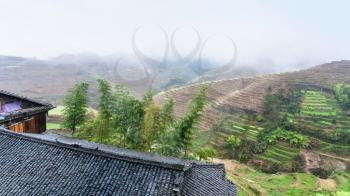 travel to China - view from Tiantouzhai village terraced hills in area Dazhai Longsheng Rice Terraces (Dragon's Backbone terrace, Longji Rice Terraces) country in spring