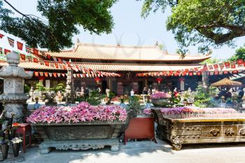 GUANGZHOU, CHINA - APRIL 1, 2017: people in court of Guangxiao Temple (Bright Obedience, Bright Filial Piety Temple). This is is one of the oldest Buddhist temples in Guangzhou city