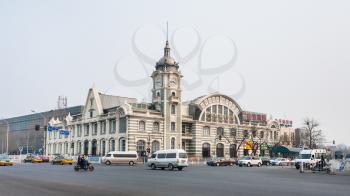 BEIJING, CHINA - MARCH 19, 2017: traffic near Zhengyangmen East Railway Station, part of the China Railway Museum on Qianmen street. This building was opened as Beijing Railway Museum in 2008