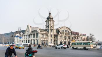 BEIJING, CHINA - MARCH 19, 2017: traffic on square and Zhengyangmen East Railway Station, part of the China Railway Museum on Qianmen street. This building was opened as Beijing Railway Museum in 2008