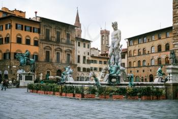 FLORENCE, ITALY - JANUARY 7, 2009: view of Piazza della Signoria and Fountain of Neptune in Florence city in winter. Fointain was built in1565 by sculptor Bartolomeo Ammannati