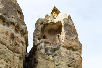 Travel to Turkey - rock-cut house in fairy chimney rock in Goreme National Park in Cappadocia in spring