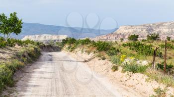 Travel to Turkey - dirty road in Goreme National Park in Cappadocia in sunny spring day