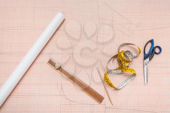 top view of hand drawn clothing pattern on sheet of graph paper