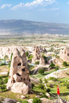 Travel to Turkey - rock pigeon houses in Uchisar town in Cappadocia in spring