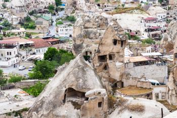 Travel to Turkey - ancient cave houses in Goreme town in Cappadocia in spring