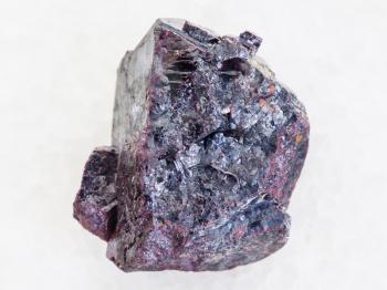 macro shooting of natural mineral rock specimen - Cuprite stone on white marble background from Altai Mountains, Russia