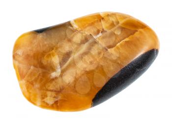 macro shooting of natural mineral stone - pebble of Simbircite ( Yellow Calcite, River Volga Amber) gemstone from Ulyanovsk region in Russia isolated on white background