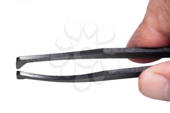 male fingers hold black plastic anti-static tweezers isolated on white background