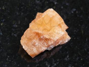 macro shooting of natural mineral rock specimen - raw crystal of Chabazite gemstone on dark granite background from Meknes-Tafilalet region, Morocco