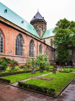 travel to Germany - green cloister of Bremen Cathedral in autumn rain