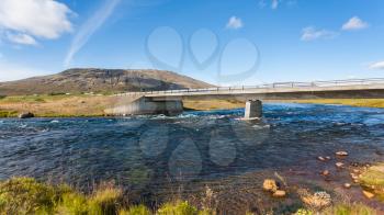 travel to Iceland - Bruara river with bridge at Laugarvatnsvegur road in autumn