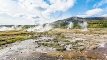 travel to Iceland - panoramic view of Haukadalur geyser valley in autumn