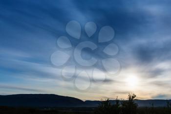 travel to Iceland - Halo (optical phenomenon) in blue sunset sky near Kerid lake in Iceland in september
