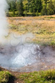 travel to Iceland - pool of small geyser in Haukadalur valley in september