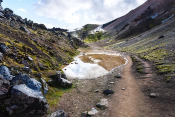 travel to Iceland - puddle near hot springs in Landmannalaugar area of Fjallabak Nature Reserve in Highlands region of Iceland in september