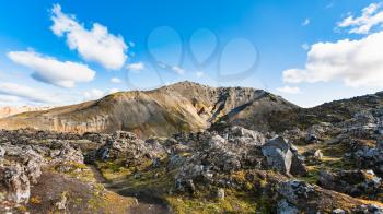 travel to Iceland - volcanic mount and at Laugahraun volcanic lava field in Landmannalaugar area of Fjallabak Nature Reserve in Highlands region of Iceland in september