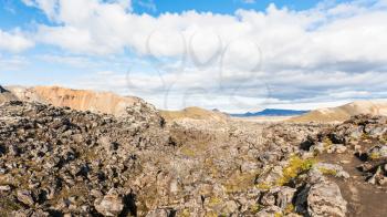 travel to Iceland - landscape of Laugahraun volcanic lava field in Landmannalaugar area of Fjallabak Nature Reserve in Highlands region of Iceland in september