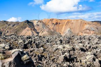 travel to Iceland - volcanic boulder on Laugahraun lava field in Landmannalaugar area of Fjallabak Nature Reserve in Highlands region of Iceland in autumn